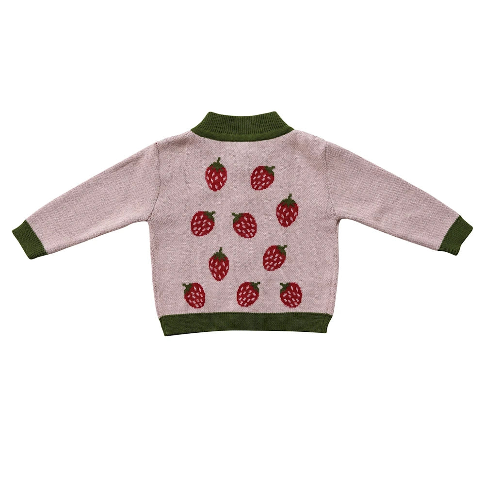 Pink cotton knit baby cardigan sweater featuring a red strawberry pattern and green ribbed trim.