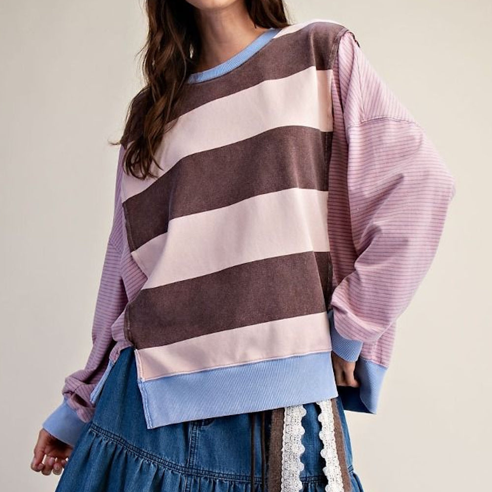 Front view of a long-sleeved pullover with brown and pink block stripes, pinstriped sleeves, and blue trim.