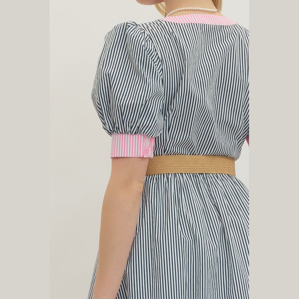 Back view of a striped puff-sleeve midi dress with pink accents and a tan woven belt.