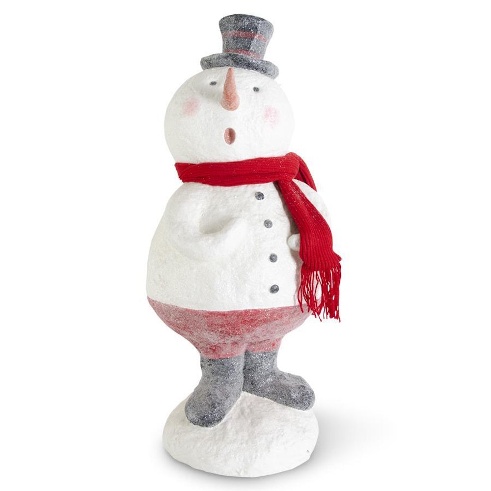 A sugar-glittered snowman figurine wearing a top hat and a red knit scarf.