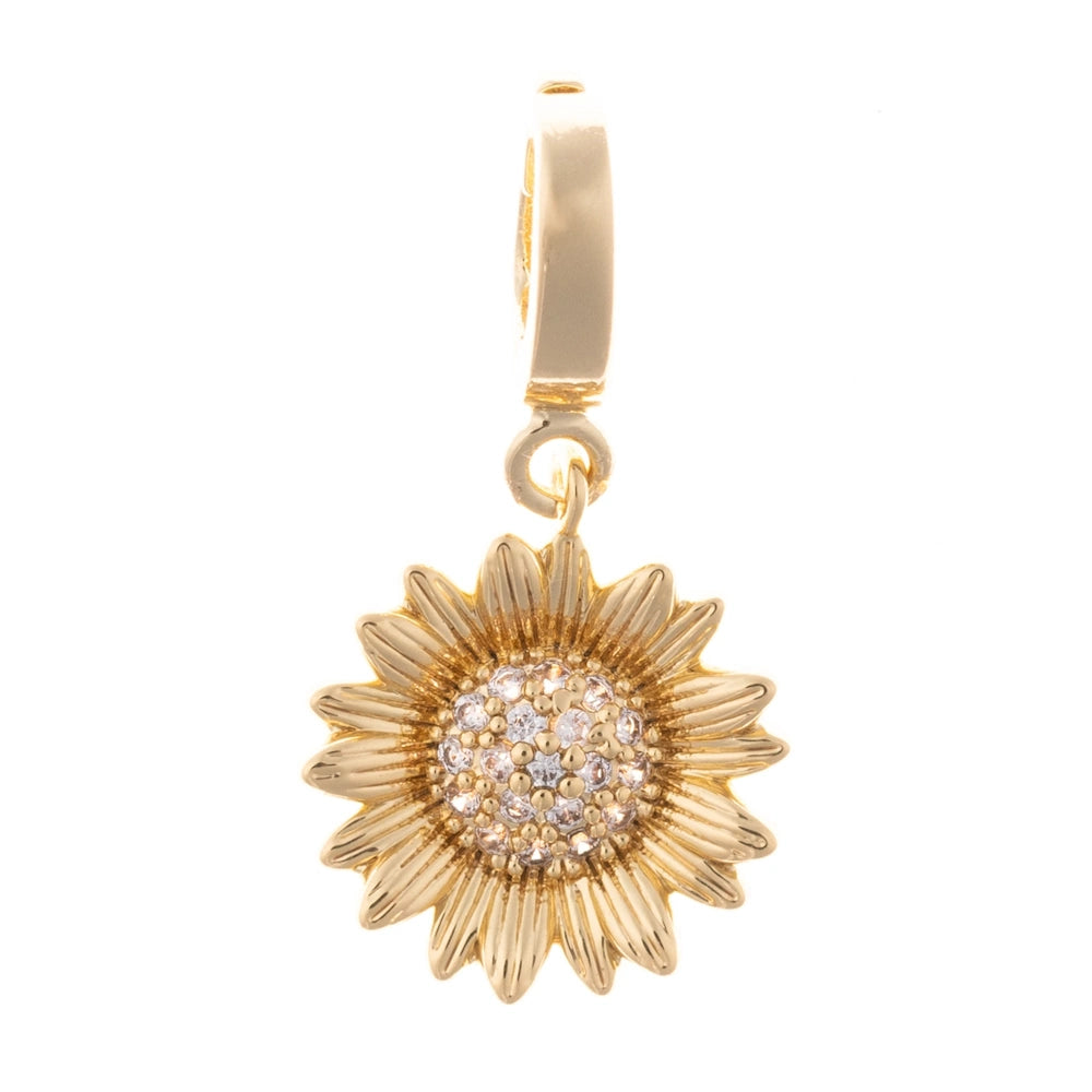 Gold sunflower charm with a pave crystal center set against a plain white background.