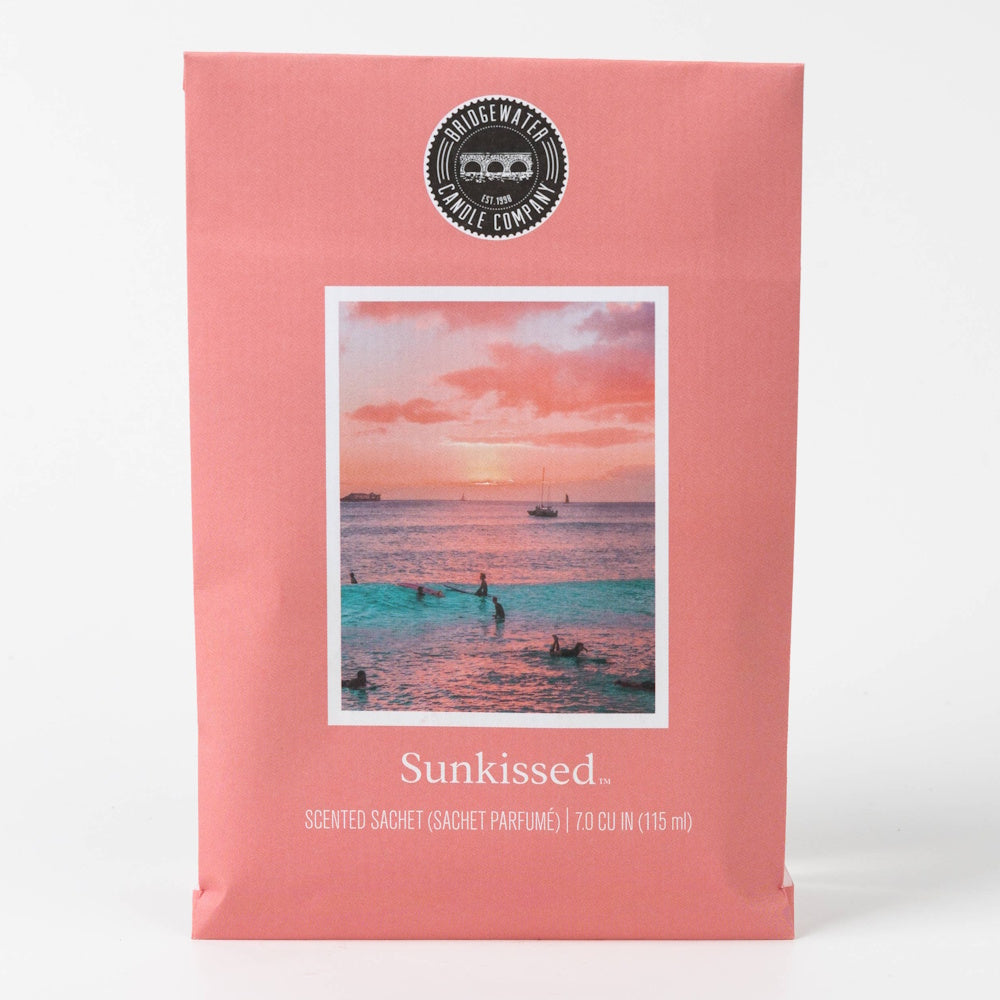 Bridgewater Candle Company Sunkissed Scented Sachet with sunset beach and surfer photo on pink packaging.