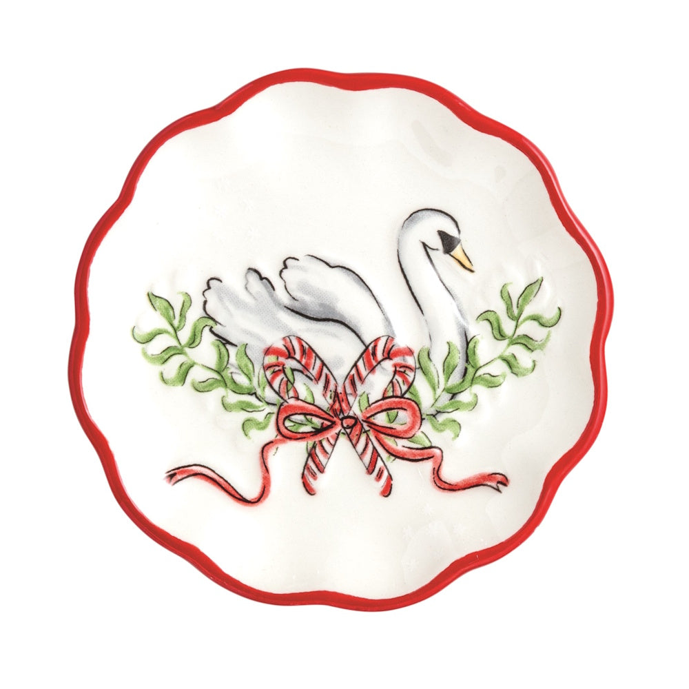 Scalloped white tidbit plate featuring a swan, candy canes, and a red bow with a red border.