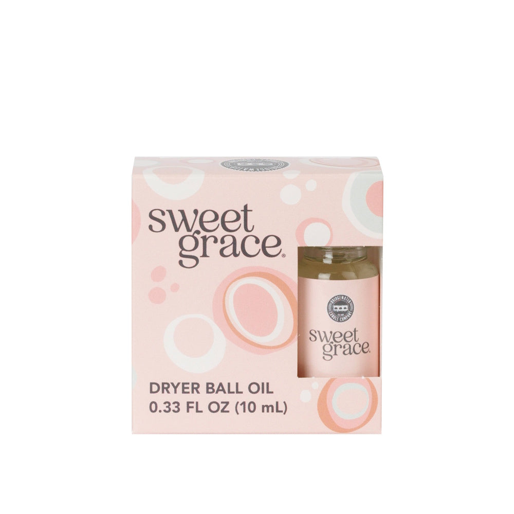 Sweet Grace dryer ball oil bottle in pink patterned packaging box against a white background.
