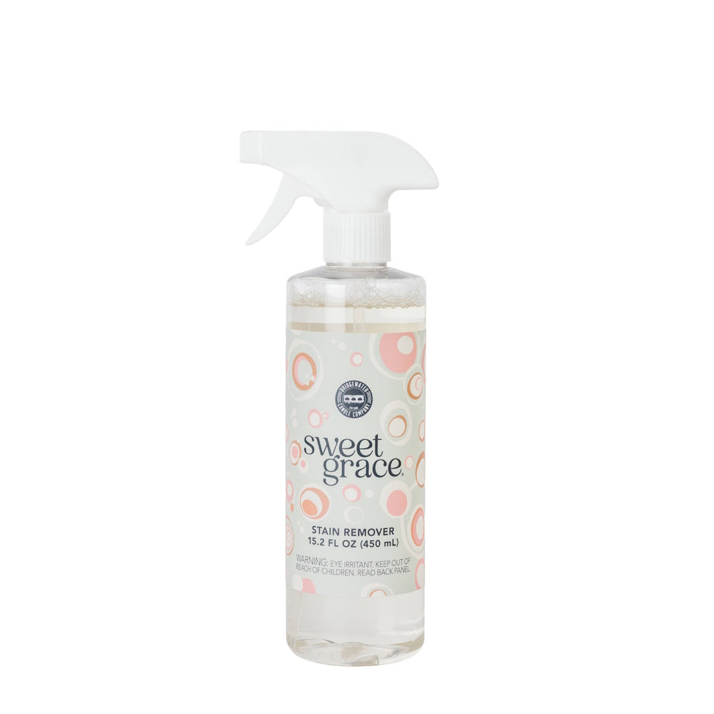 Sweet Grace clear stain remover spray bottle with pink patterned label and white trigger nozzle.