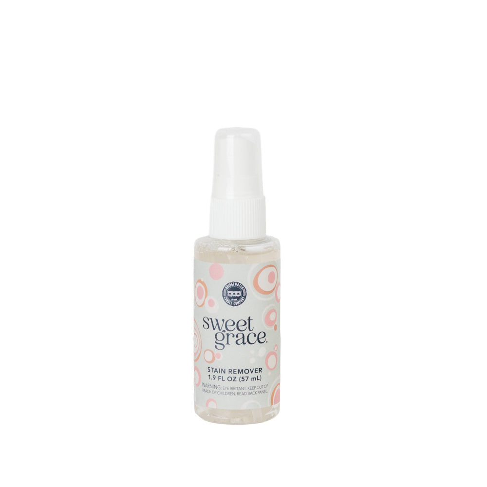 Sweet Grace 1.9 fl oz travel-size stain remover spray bottle with a white nozzle.