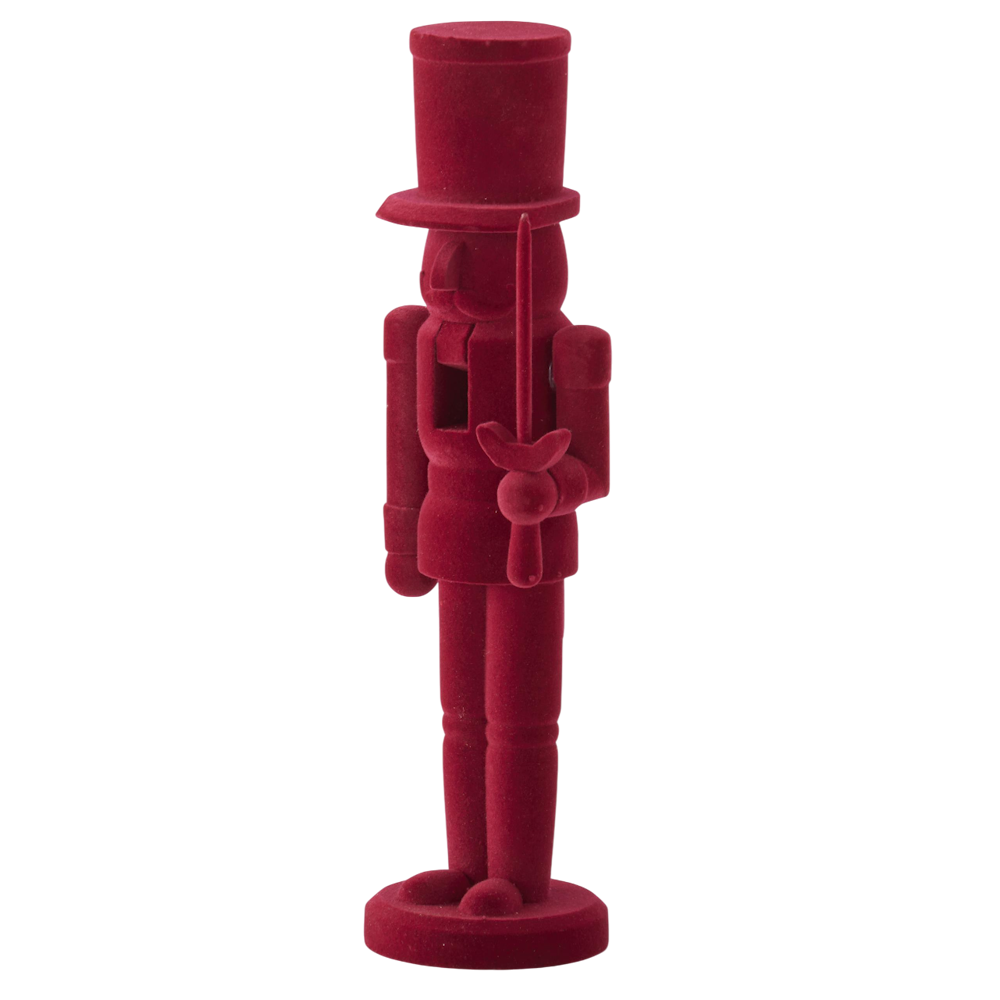 A wooden nutcracker soldier figure wearing a top hat and holding a sword, covered in a solid burgundy velvet texture.