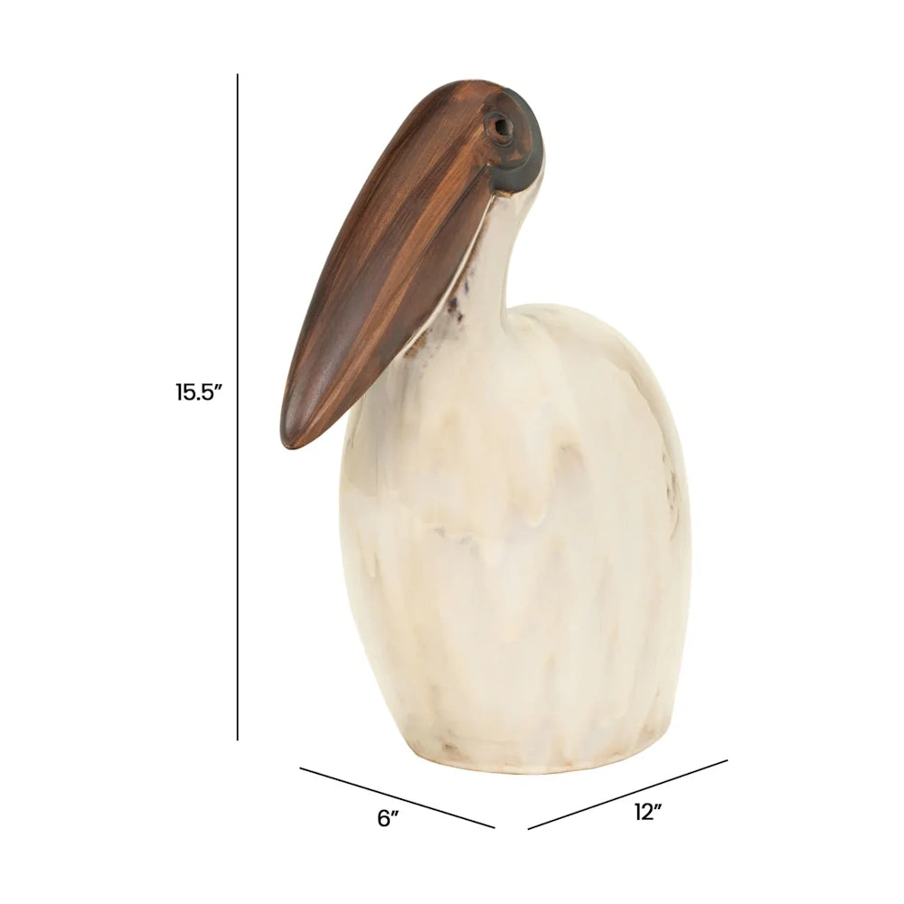 A cream pelican sculpture shown with dimensions: 15.5 inches high, 6 inches wide, and 12 inches deep.