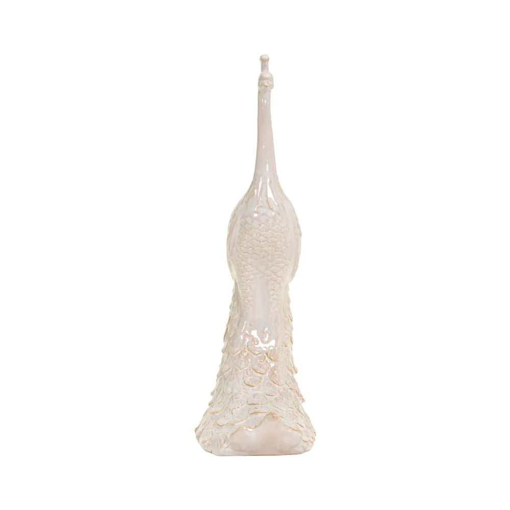 Front view of a tall, off-white peacock sculpture featuring detailed textured feathers and a long neck.