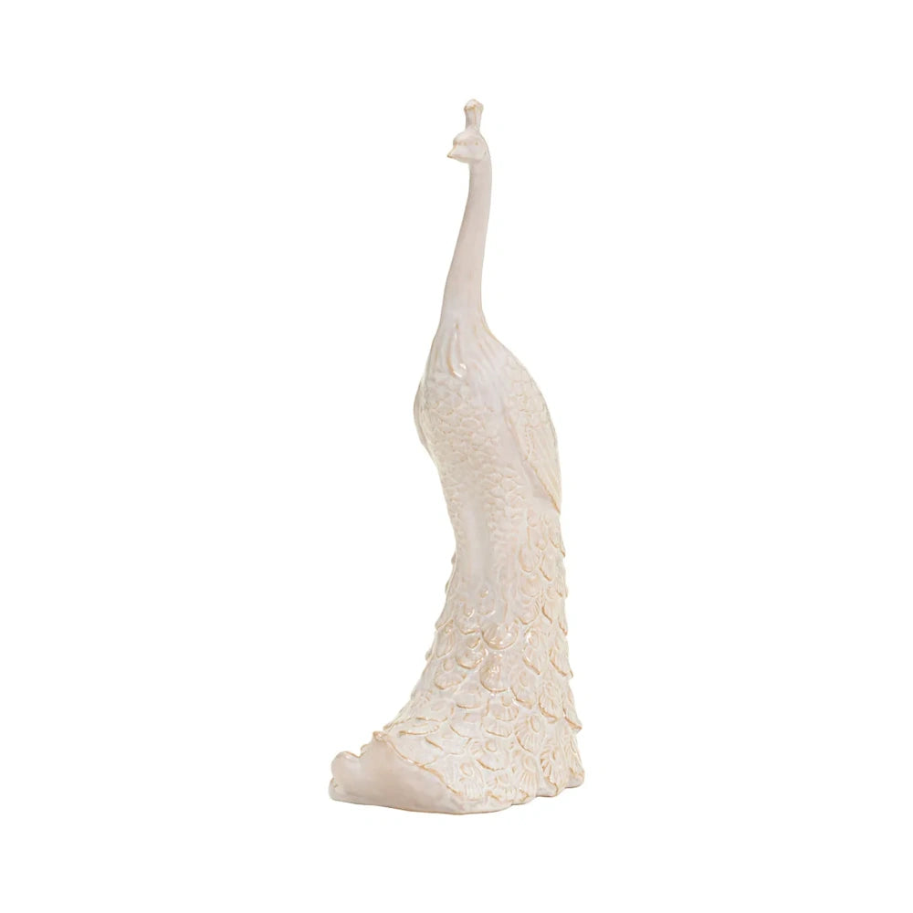 Tall, glossy off-white ceramic peacock figurine with detailed feather carving on a white background.