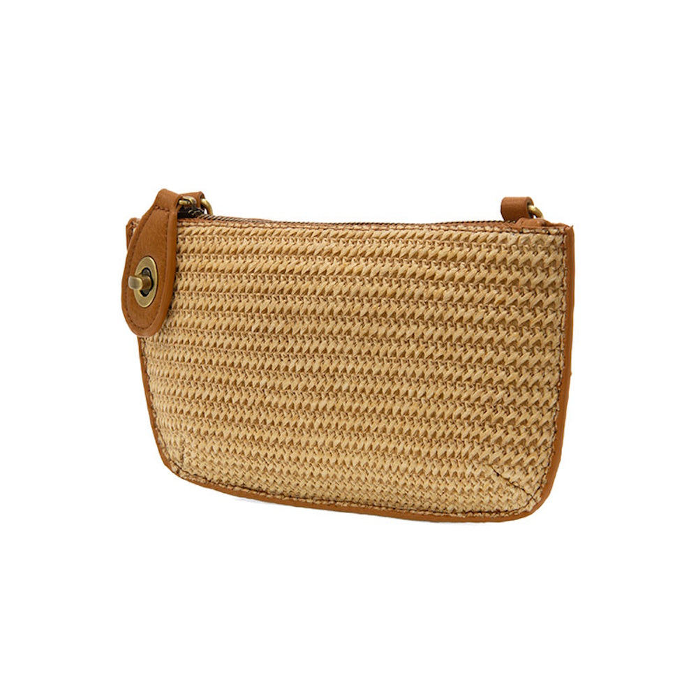 Tan woven straw mini crossbody bag with brown faux-leather trim and a gold-tone turn-lock zipper detail on a white background.