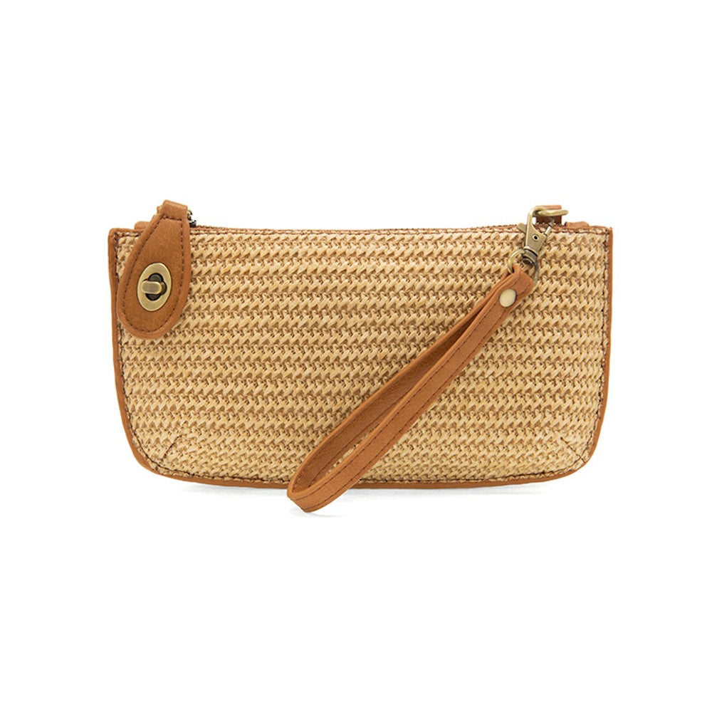 Tan woven straw mini wristlet crossbody bag with brown faux leather trim, gold-tone hardware, and a matching wrist strap.
