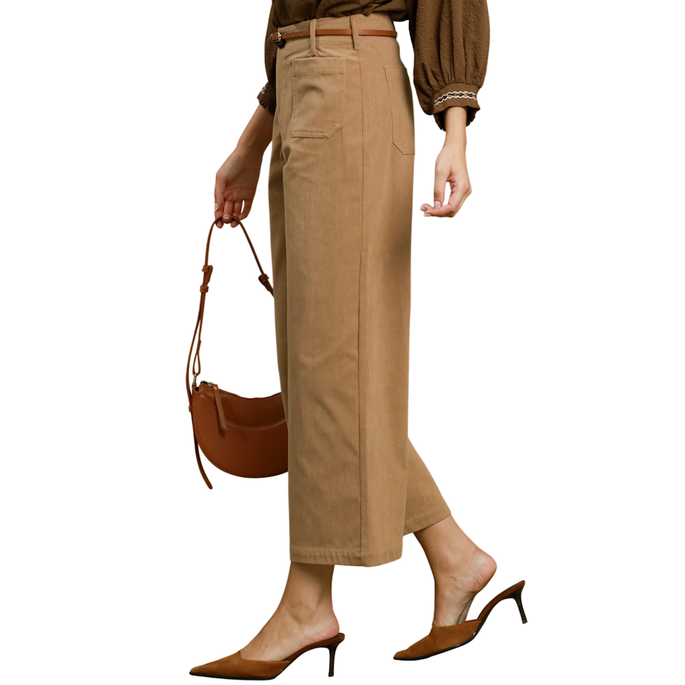 Side view of tan corduroy high-waisted wide-leg pants styled with a belt, shoulder bag, and heels.