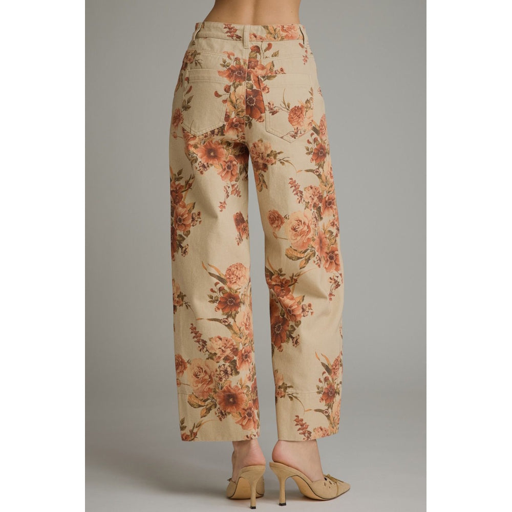 Back view of taupe wide-leg pants with a warm brown floral print and rear patch pockets.