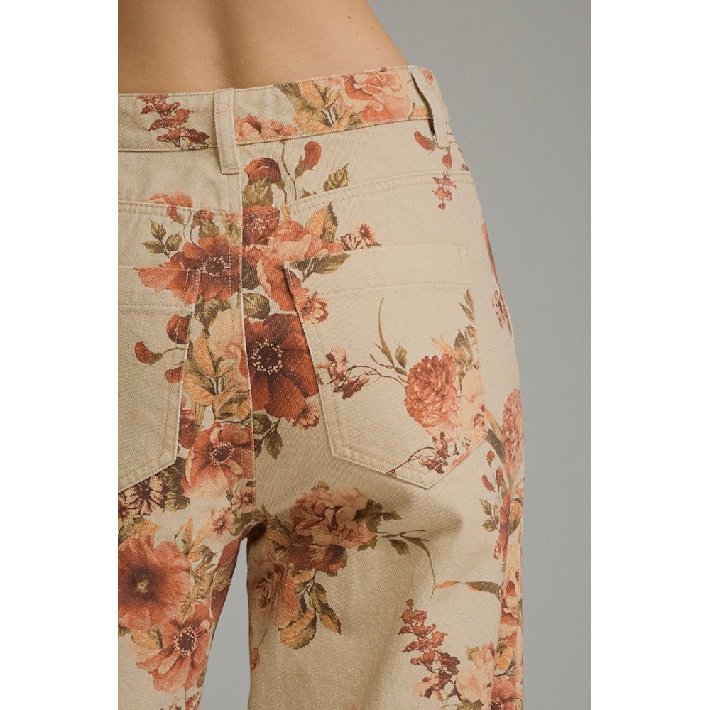 Close-up rear view of taupe floral print wide-leg pants highlighting waistband and back patch pockets.