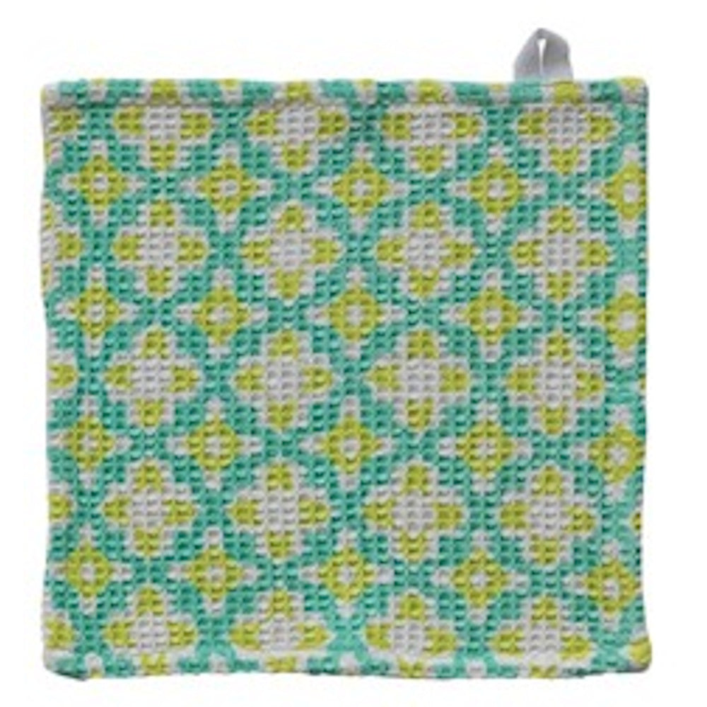 Square waffle-weave dishcloth with a teal, lime green, and white geometric floral pattern and a small white hanging loop.