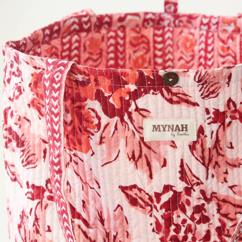 Mynah by Smitha reversible terracotta floral print quilted cotton tote bag featuring a wood button closure.