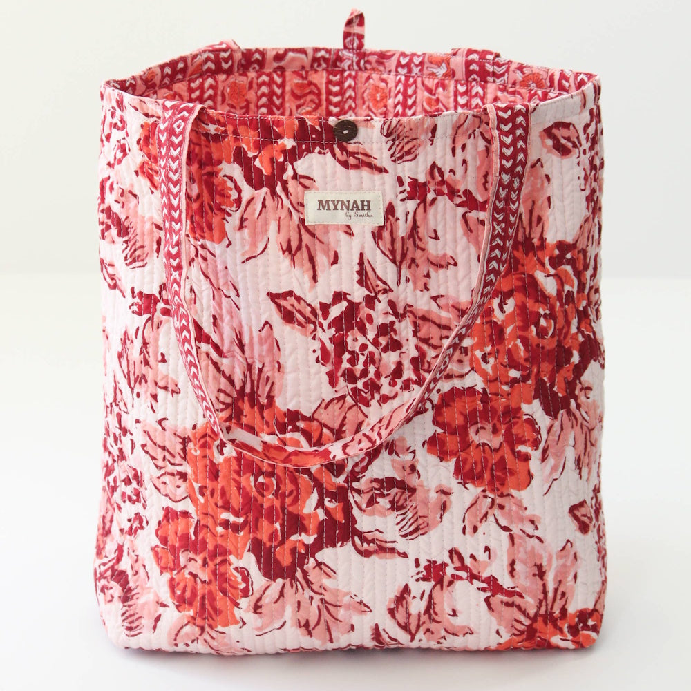 Terracotta floral print quilted tote bag with reversible design and patterned straps by MYNAH by Smitha.