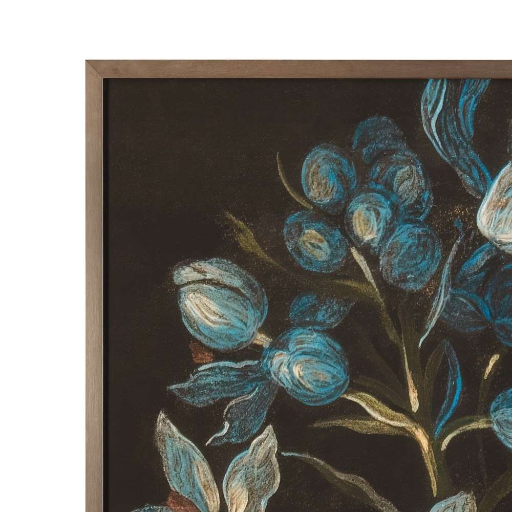 Close-up detail of a dark framed botanical artwork showing textured blue flower buds and a slim bronze frame.