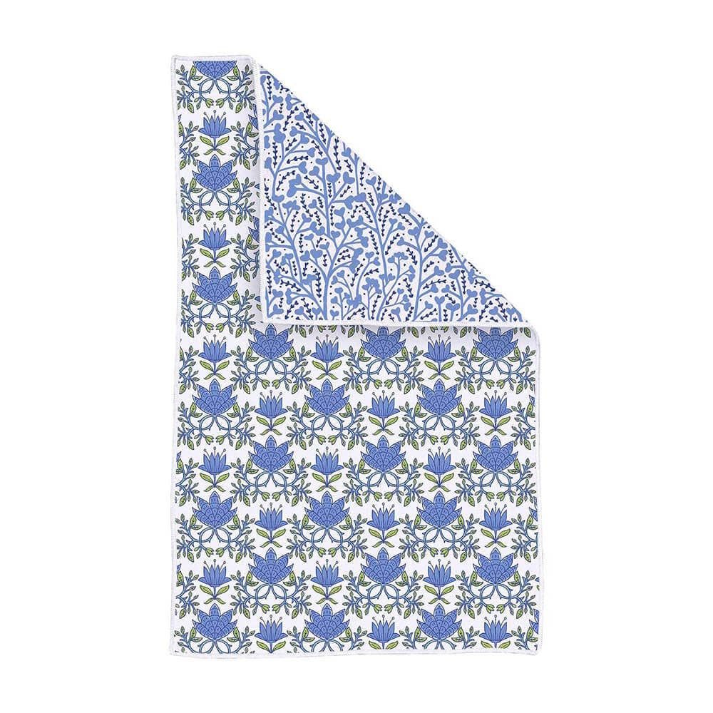 White kitchen towel with a blue and green floral pattern, partially folded over to show a reverse pattern.