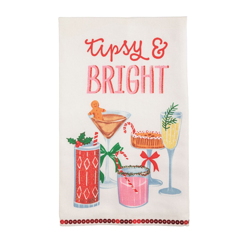 Holiday towel with festive cocktails and the text "Tipsy & BRIGHT" in red and pink lettering.