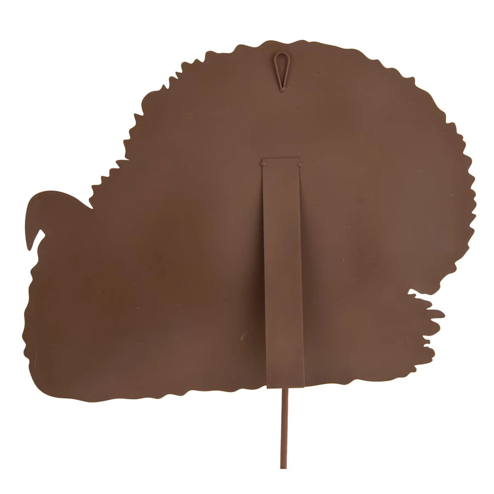 The back of a brown metal turkey lawn decoration, showing its support stake and wall-hanging loop.