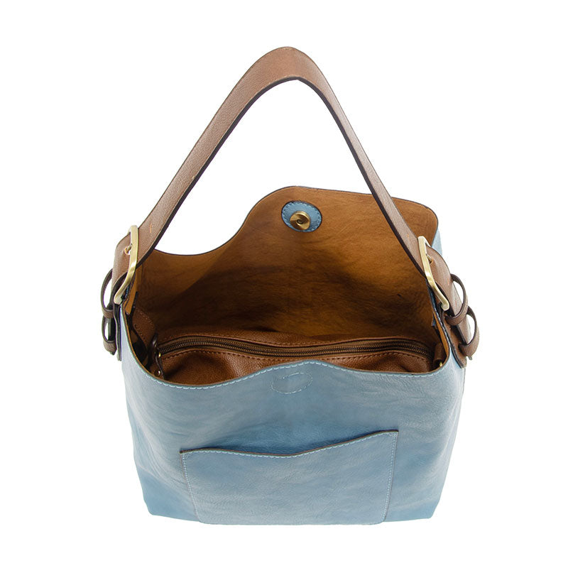 Tranquil blue hobo handbag with a coffee brown handle, open top showing interior pockets, and a front slip pocket.