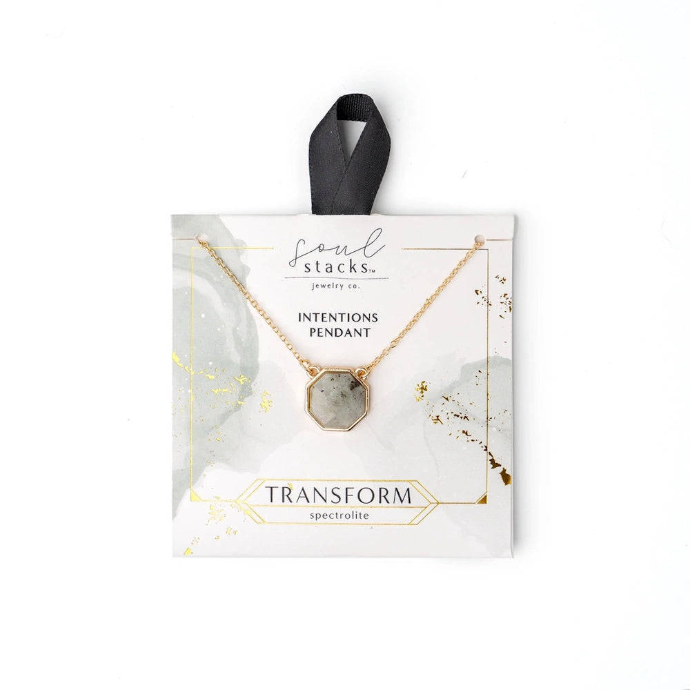 Soul Stacks Transform Intentions Pendant featuring a spectrolite stone on a gold chain with retail packaging.