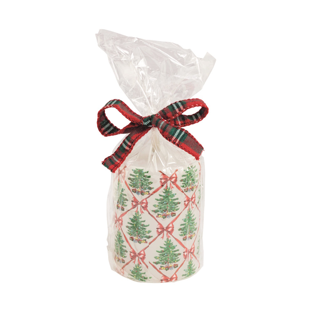 White Christmas tree print flameless pillar candle in clear plastic with a plaid bow, front view.