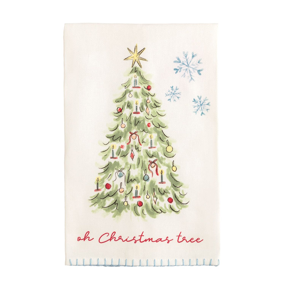 White towel featuring an illustrated Christmas tree, snowflakes, and red cursive text "oh Christmas tree".