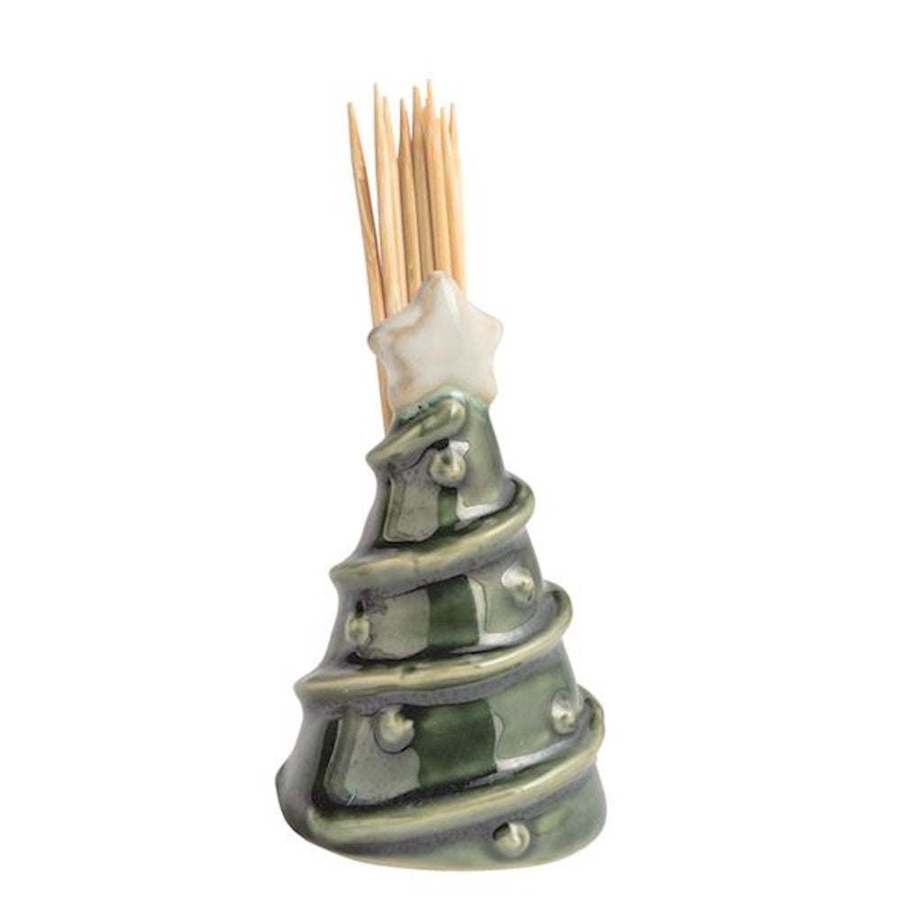 Green ceramic Christmas tree toothpick holder with wooden toothpicks coming out of the top.