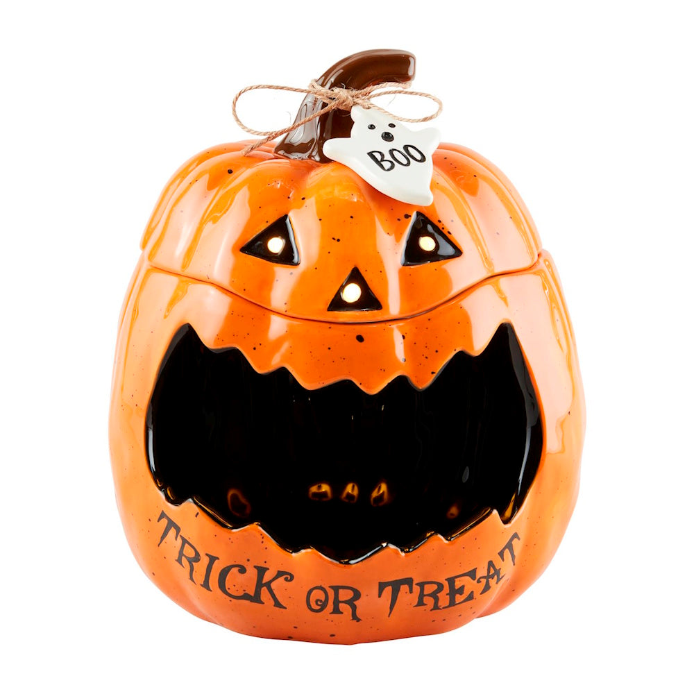 Ceramic trick-or-treat jack-o'-lantern pumpkin candy container with ghost "BOO" tag.