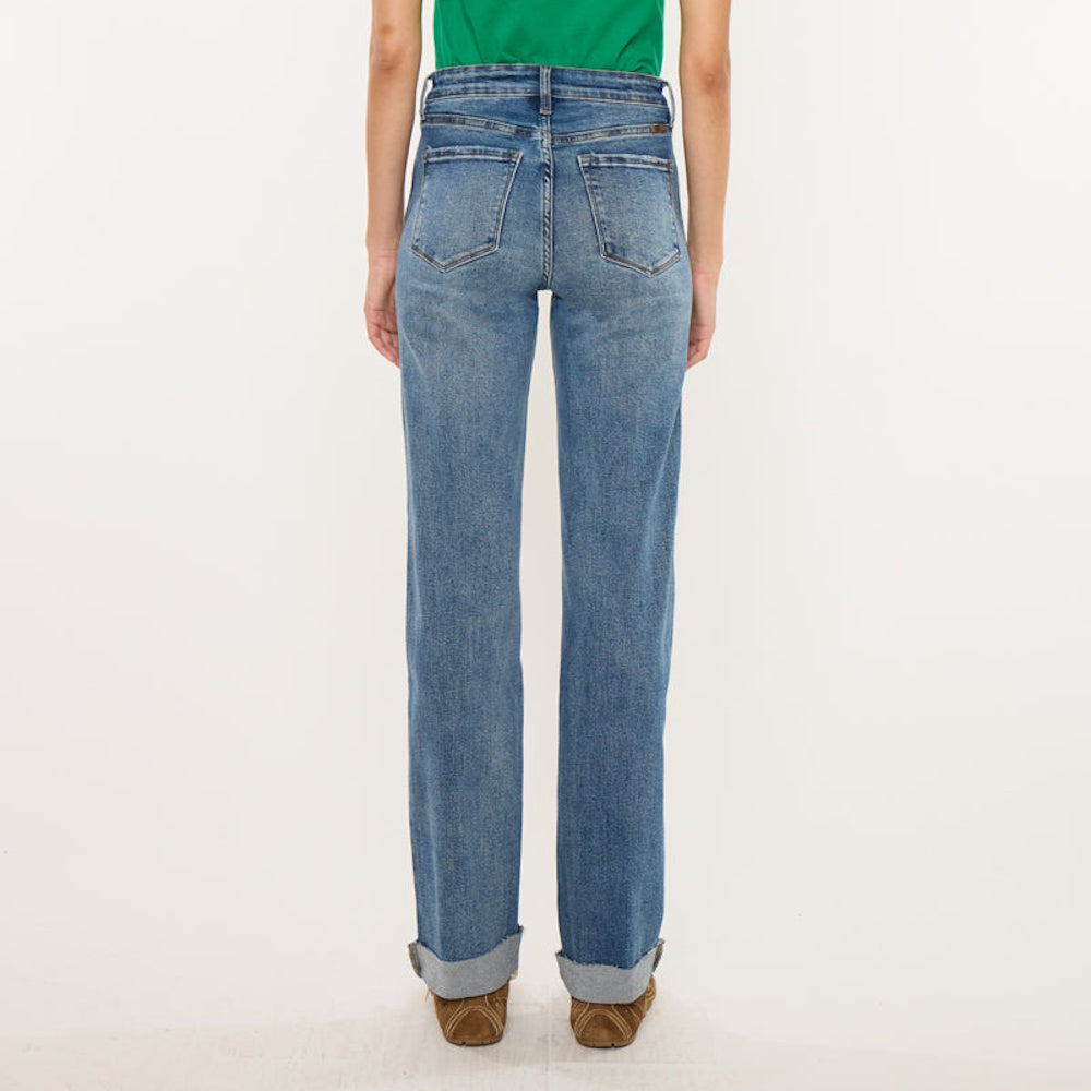 Back view of high-rise straight-leg blue jeans with back pockets and cuffed hems.