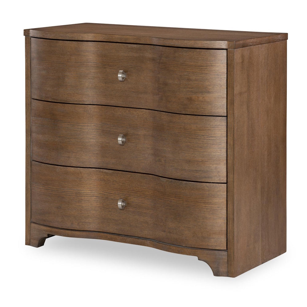 Modern walnut 3-drawer dresser with curved wave front and silver knobs on white background.