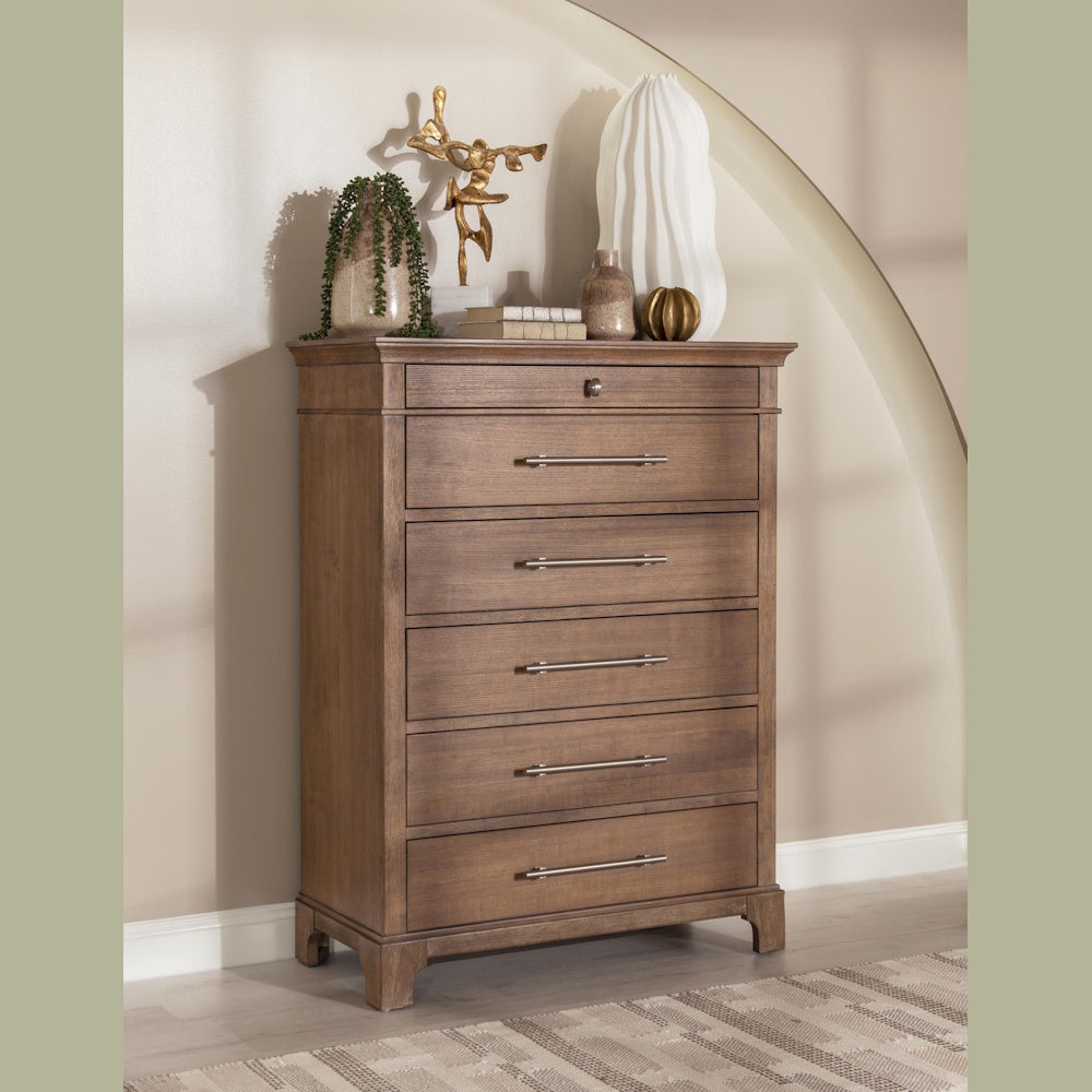 Trisha Yearwood Harmony 5-drawer chest in a warm brown wood finish with silver hardware.