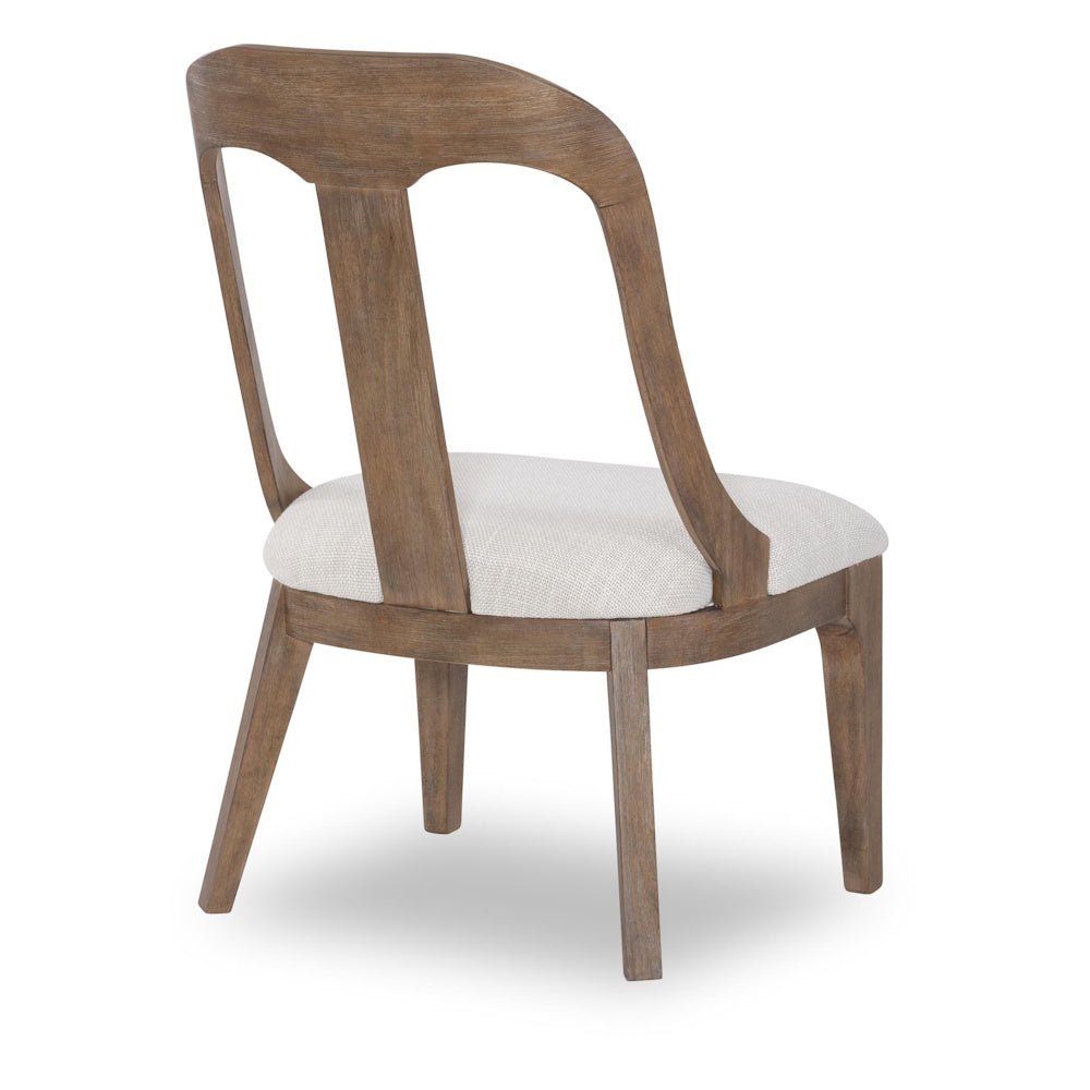Trisha Yearwood Harmony wood side chair with upholstered seat, back view.