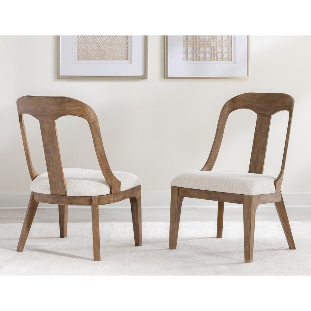 Pair of mid-century modern wood dining chairs with upholstered seats on a white rug.