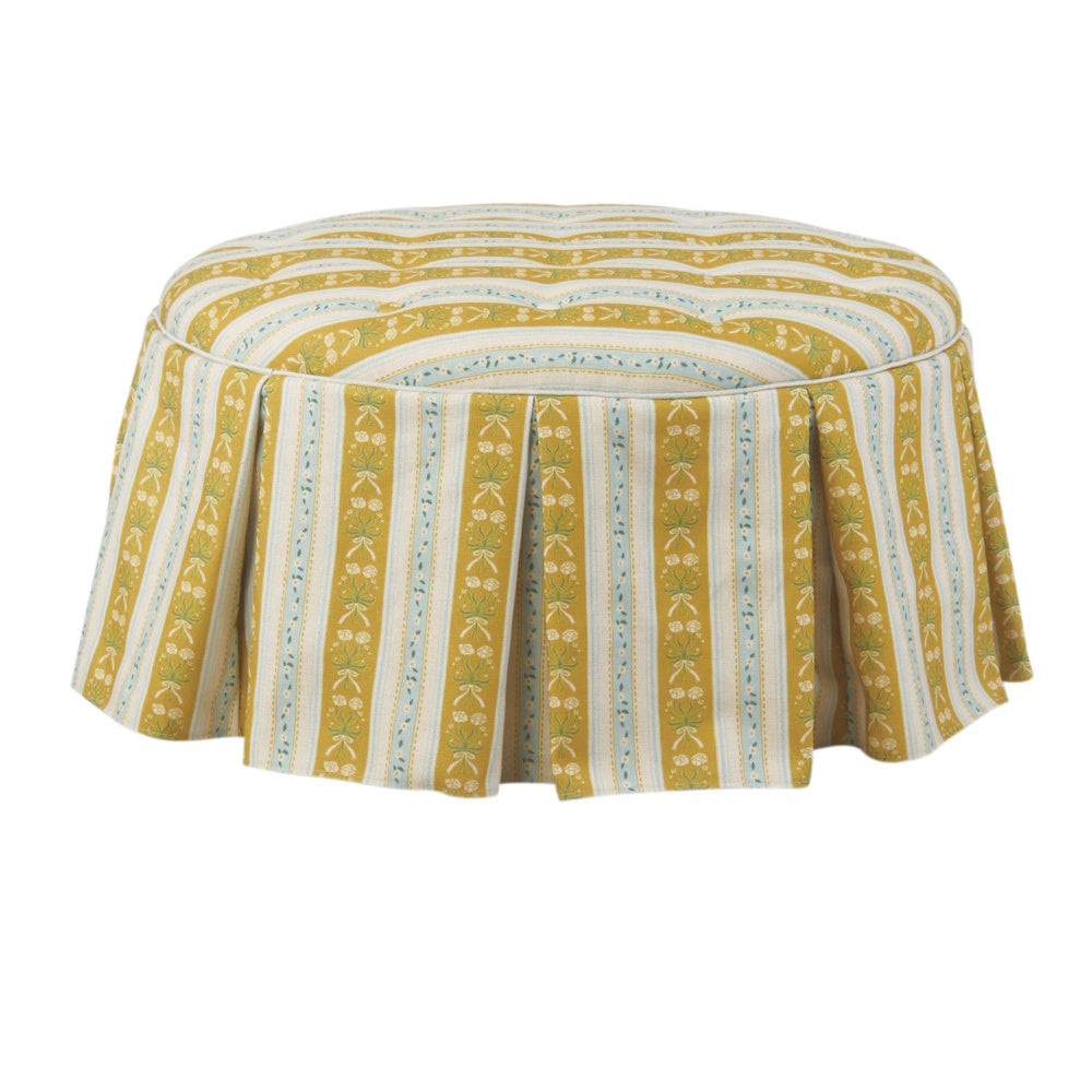 Yellow and blue striped floral tufted ottoman with box pleat skirt and piping.
