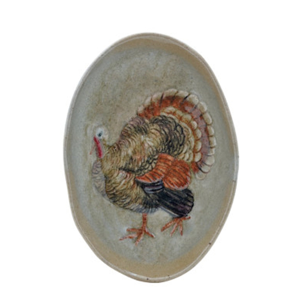 Hand-painted oval stoneware plate featuring a turkey illustration with fanned tail feathers.