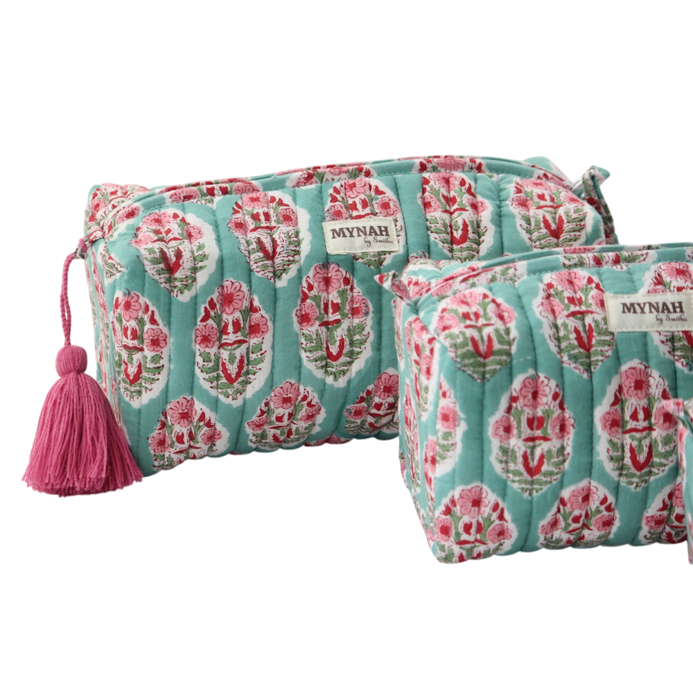 Quilted turquoise block-print makeup bags with pink floral patterns and a tassel by MYNAH.