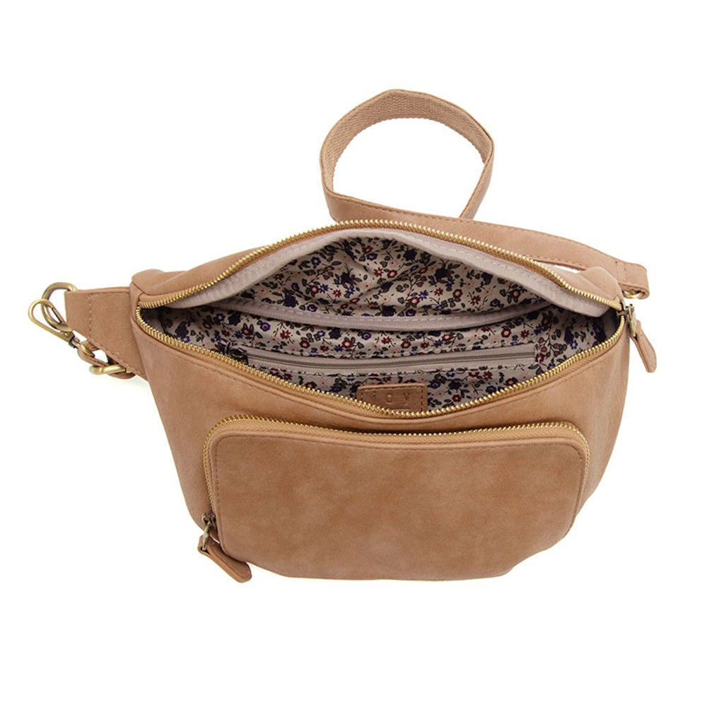 Tan faux suede belt bag with open zipper showing floral lining, interior pocket, and front zip compartment on white background.