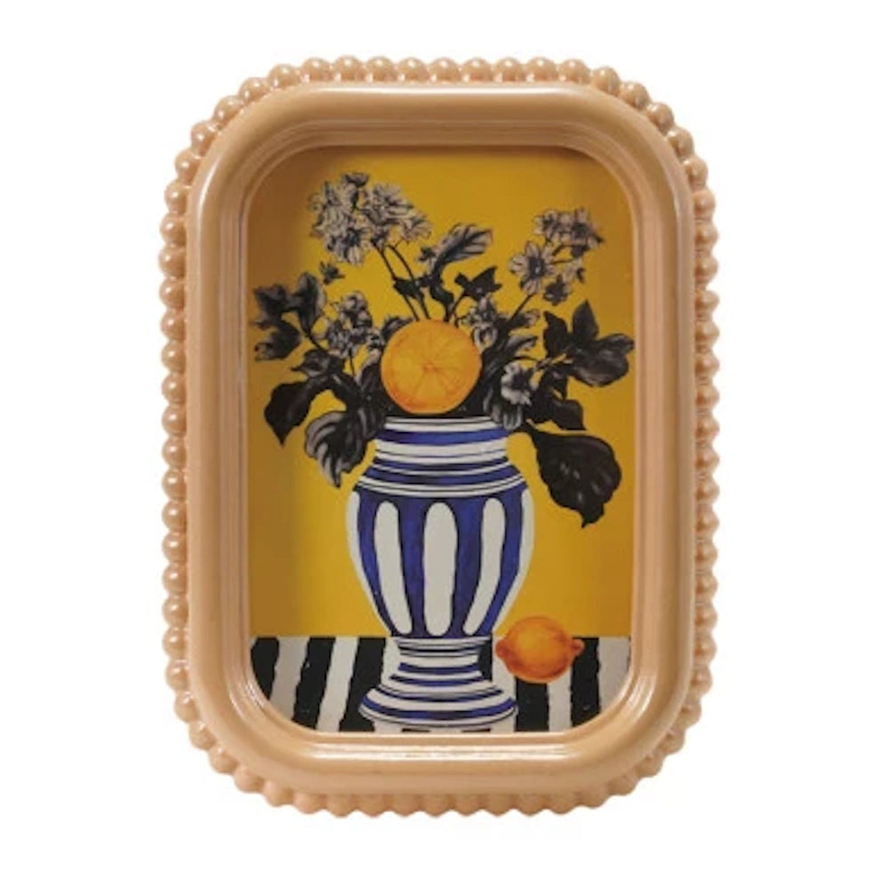 Beaded peach picture frame featuring a still life of a blue and white striped vase with flowers on a yellow background.