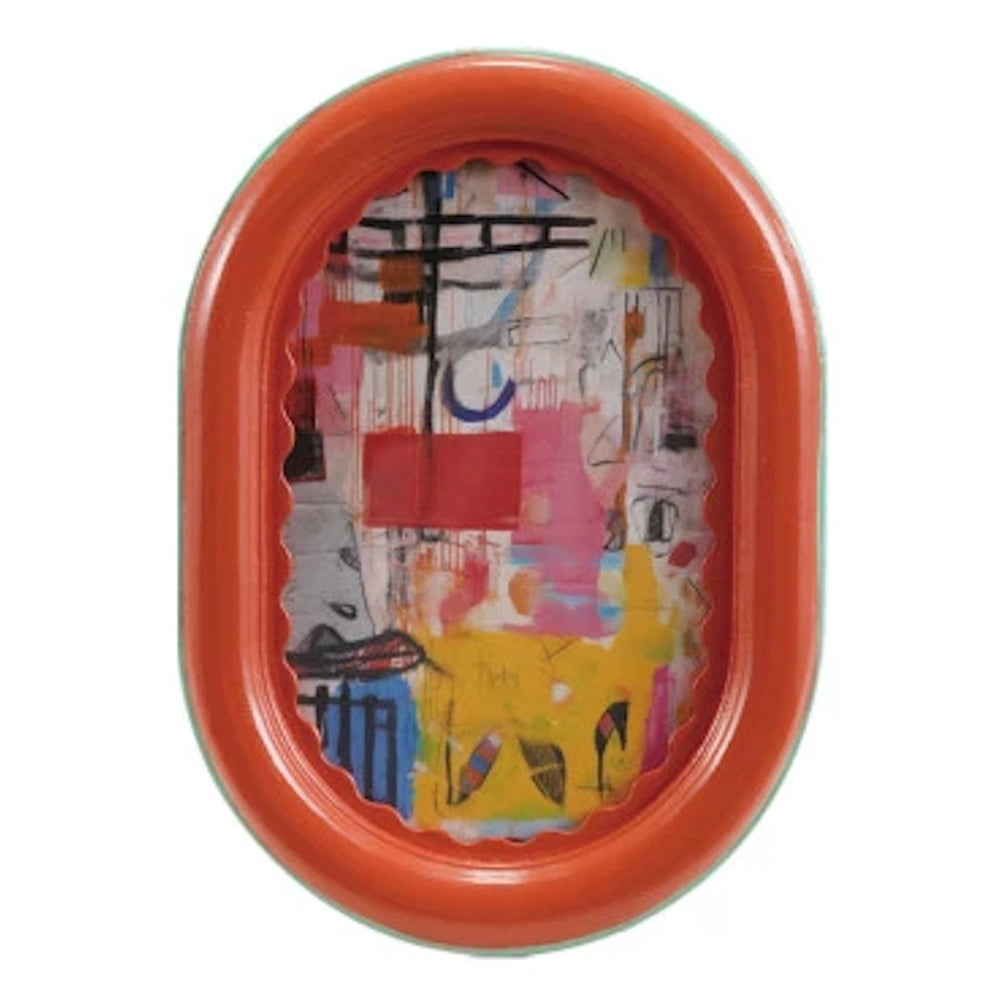 Oval orange picture frame with a ruffled inner edge featuring colorful abstract mixed media artwork.
