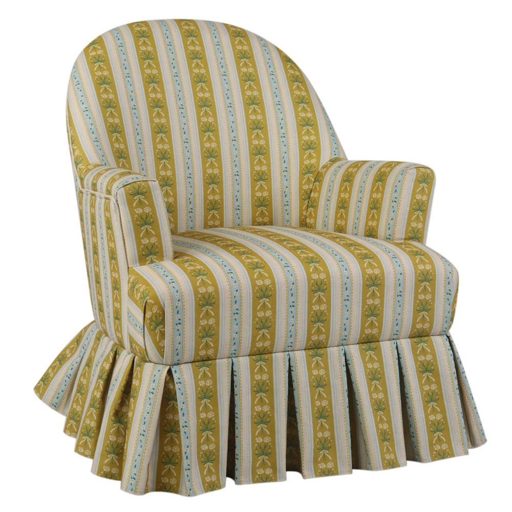Upholstered armchair with yellow and blue stripes, piping, and a box pleat skirt.