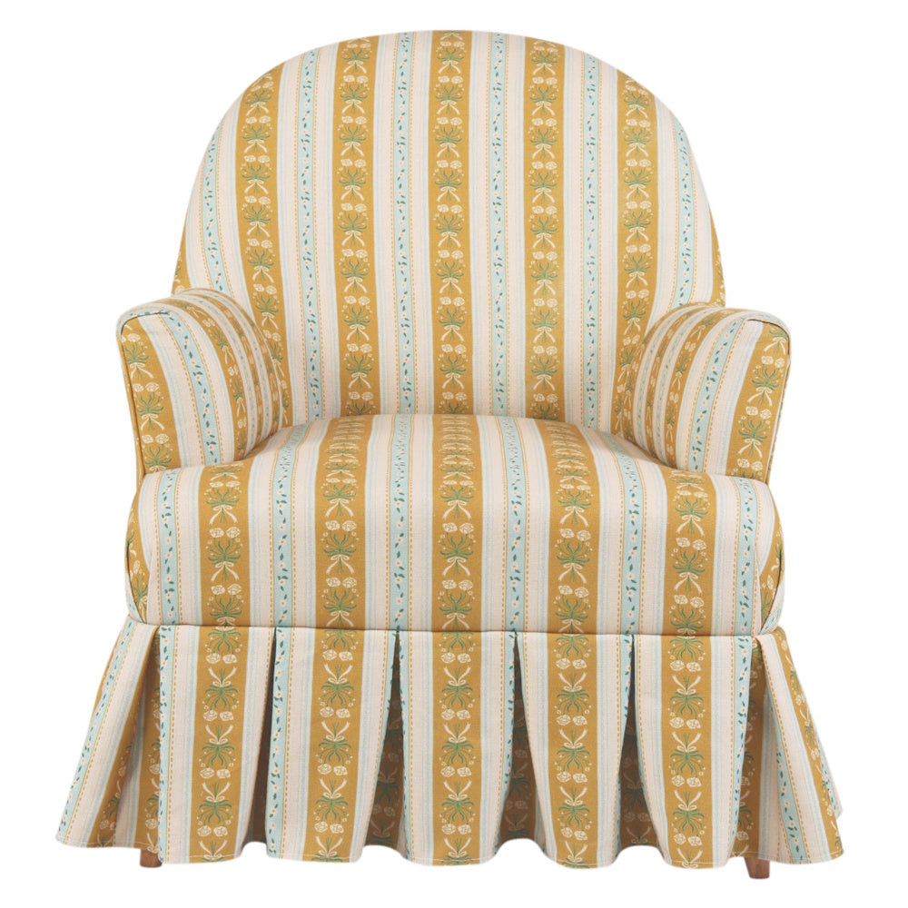 Yellow striped floral upholstered armchair with box pleat skirt and piping.