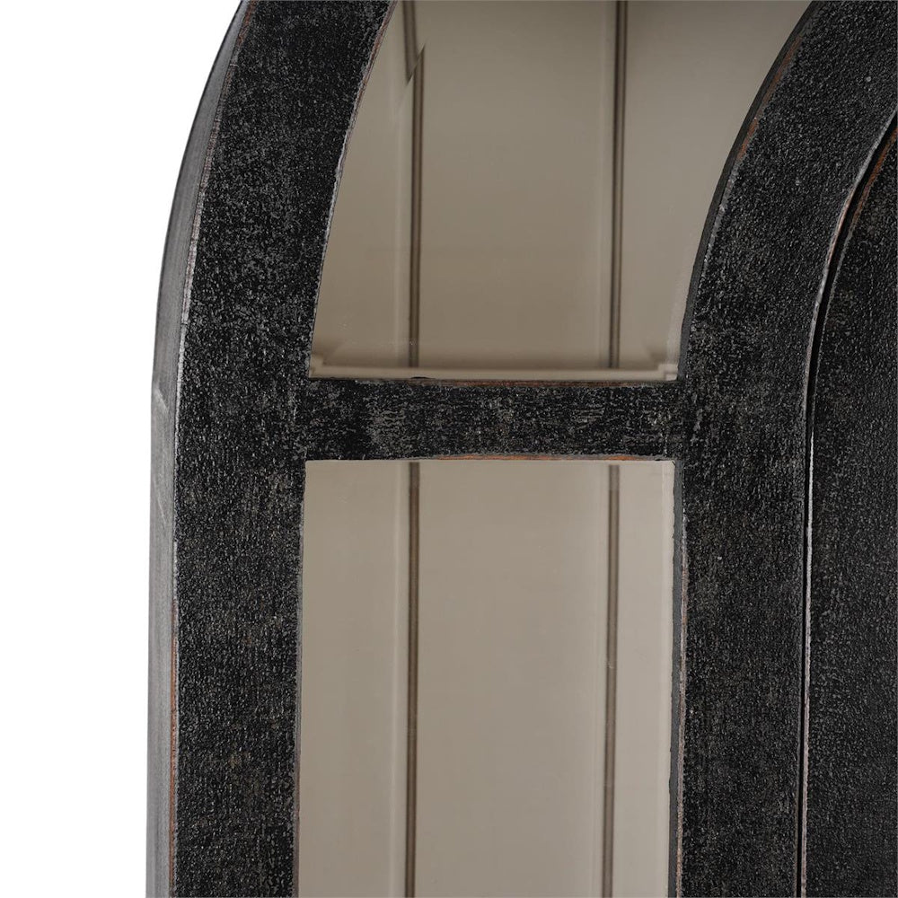 Close-up of the Vannes arched black display cabinet featuring glass shelves and textured wood framing.