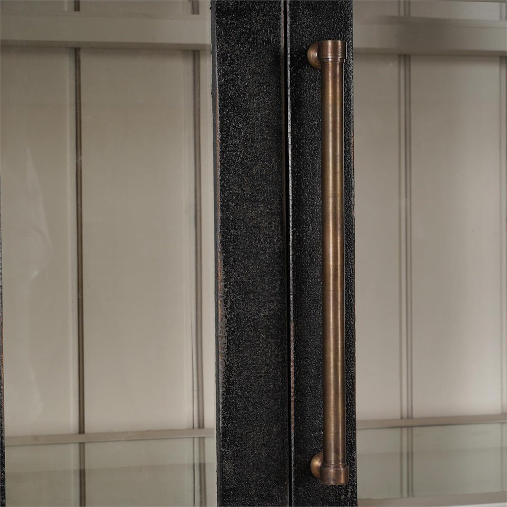 Close up of a brass handle on the Vannes black display cabinet glass door.