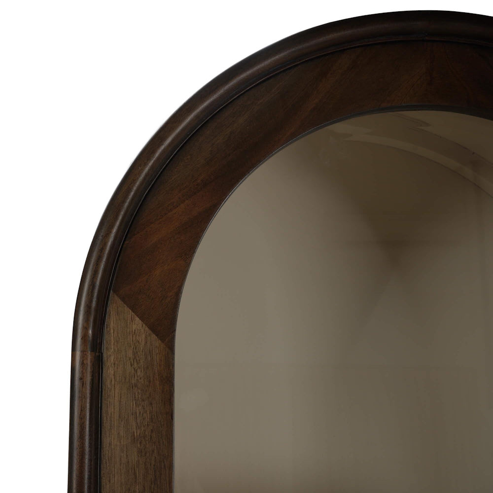 Arched dark wood top detail of a Vannes single door display cabinet with glass panel.