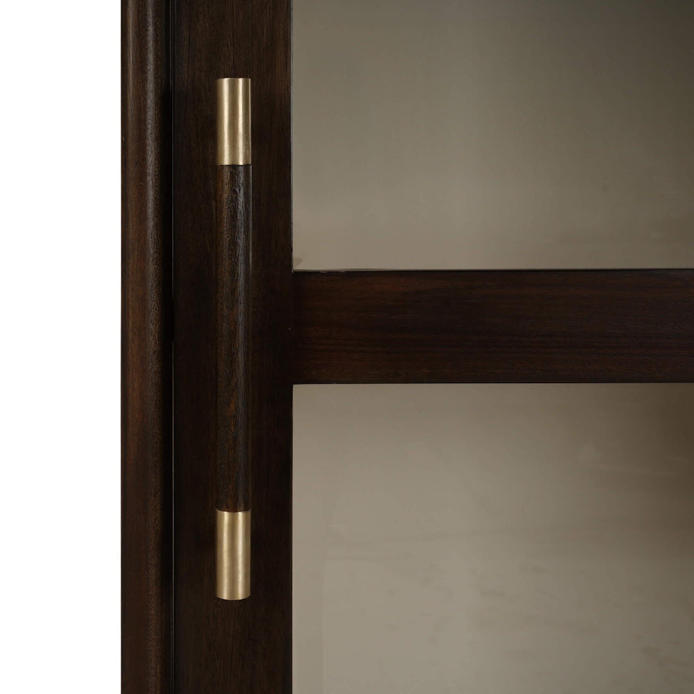 Close-up of a Vannes single door display cabinet with a dark wood and gold handle.