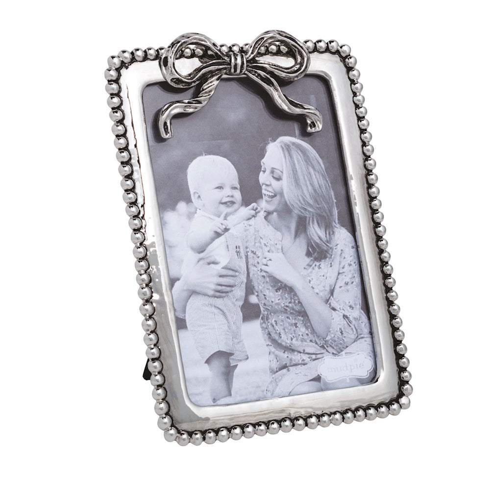 Vertical silver beaded metal picture frame featuring a decorative ribbon bow accent on the top edge.
